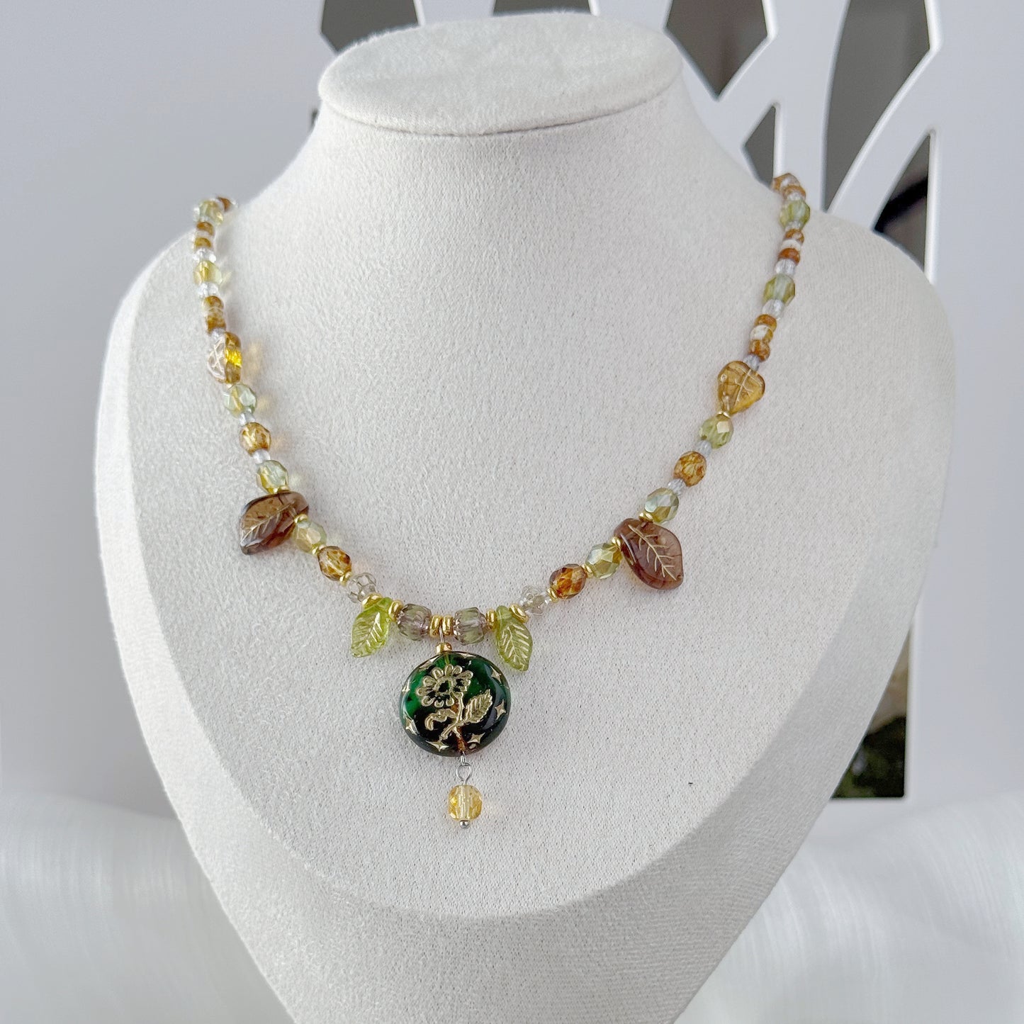 Handmade botanical Czech glass pendant necklace with leaf beads and green floral pendant