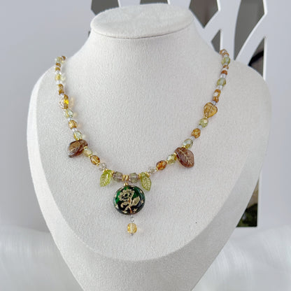 Handmade botanical Czech glass pendant necklace with leaf beads and green floral pendant