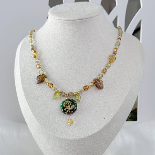 Handmade botanical Czech glass pendant necklace with leaf beads and green floral pendant