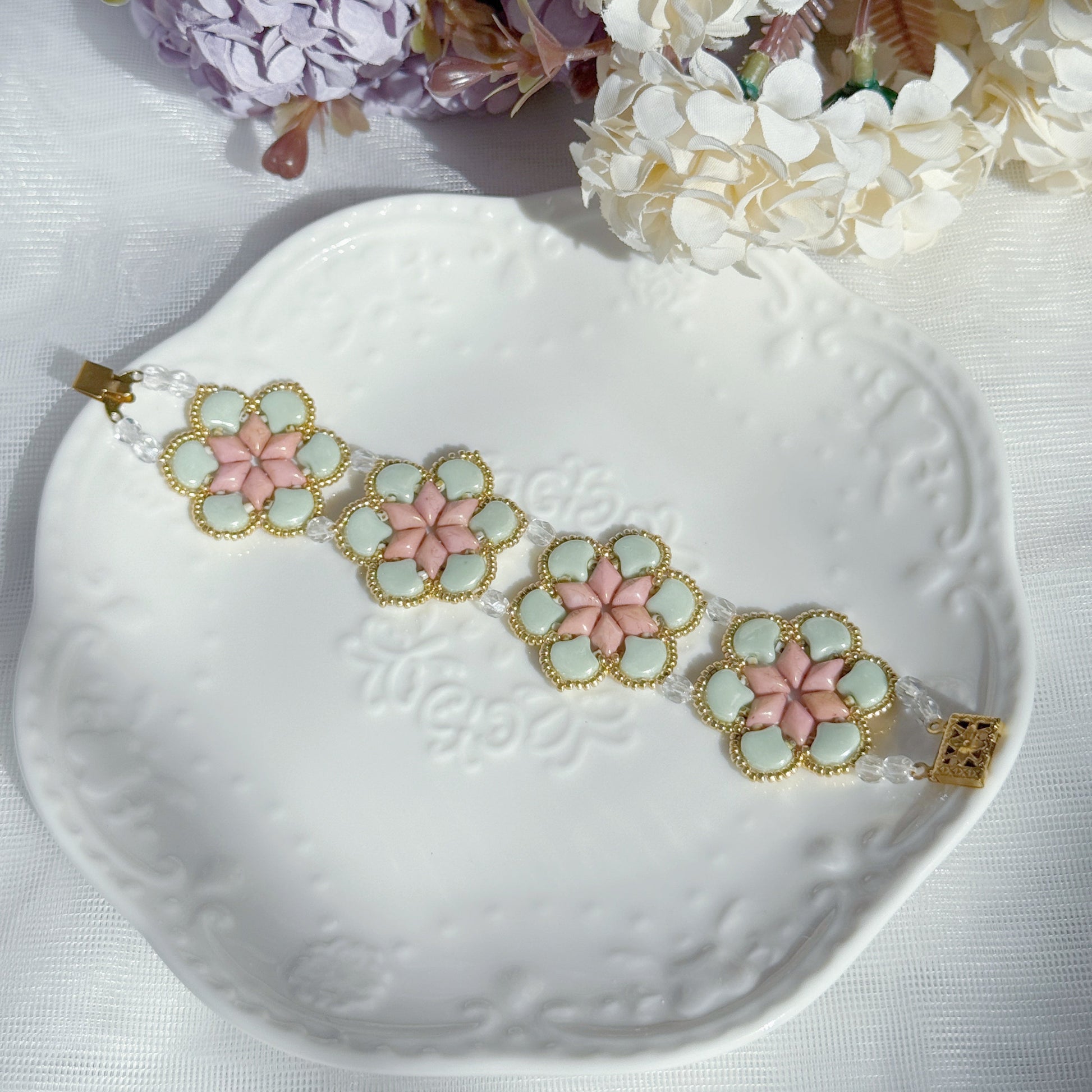 handmade Czech glass beaded bracelet with floral pattern in soft mint green and pink botanical jewelry