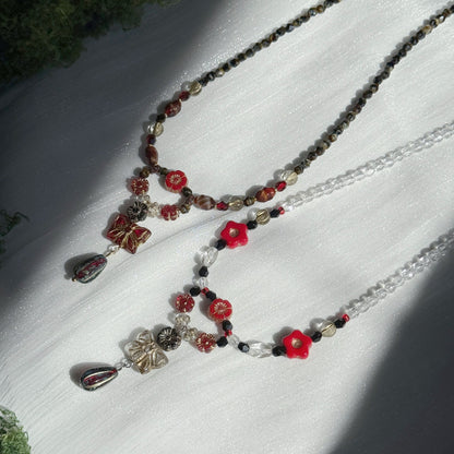 red and black handmade czech glass floral pendant necklaces with red flower beads and beaded chains botanical jewelry