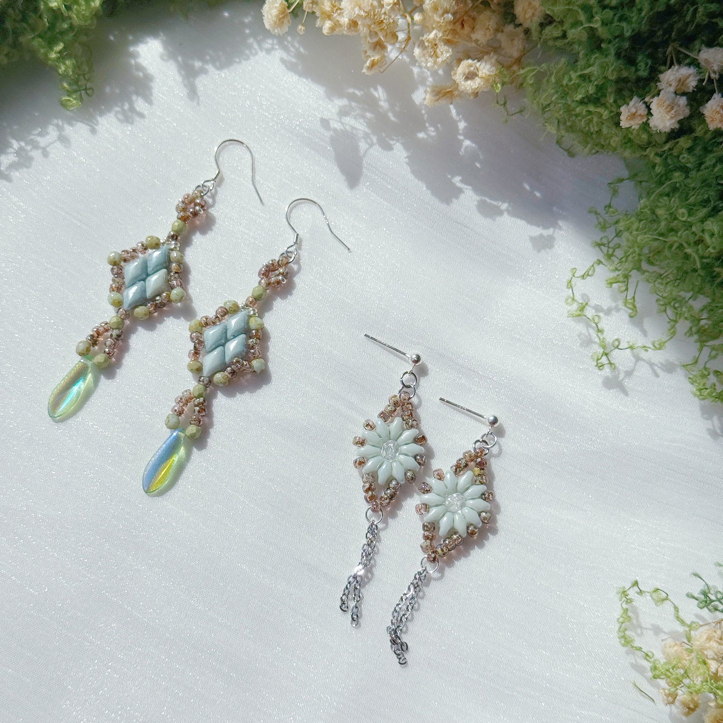 handmade czech glass beaded drop earrings in mint green floral and diamond designs with delicate dangle details