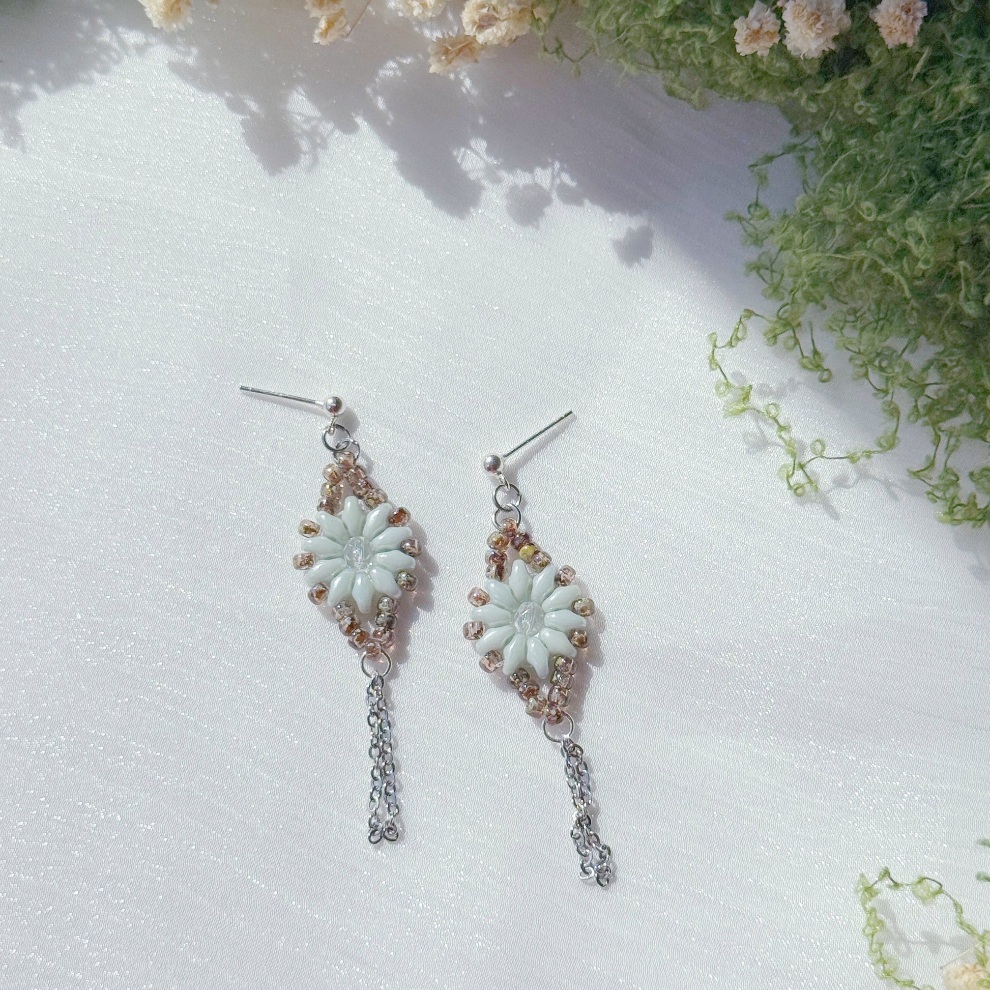 handmade czech glass floral earrings with beaded design and delicate chain dangle in soft mint tones