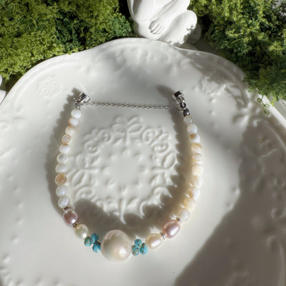 freshwater pearl bracelet with large iridescent focal pearl high luster pearls and shell beads handmade elegant jewelry