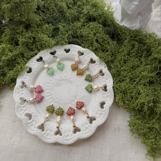 Multicolor earrings featuring maple leaf beads and freshwater pearls