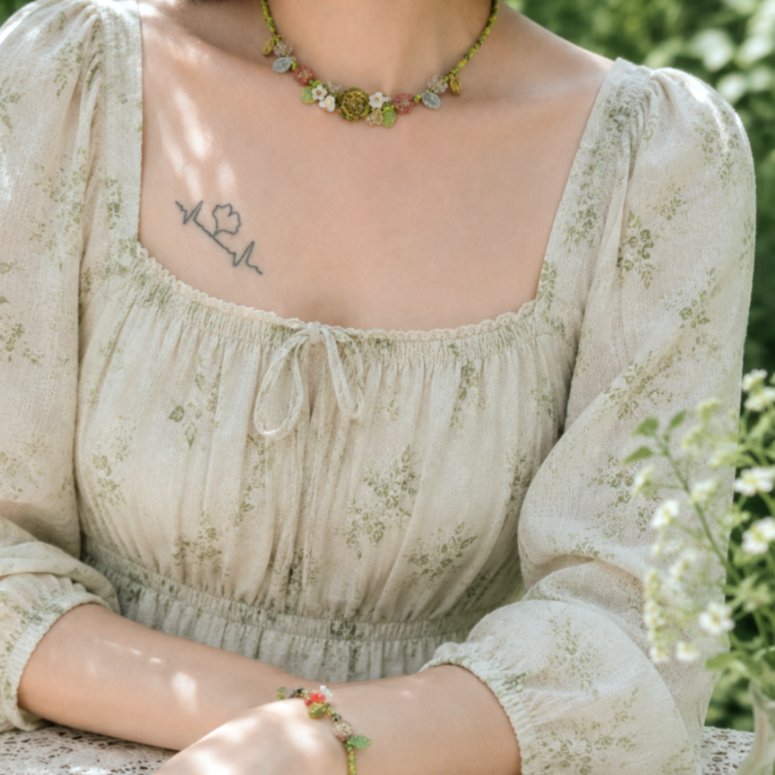Model shots of necklaces and bracelets with a fresh green aesthetic.